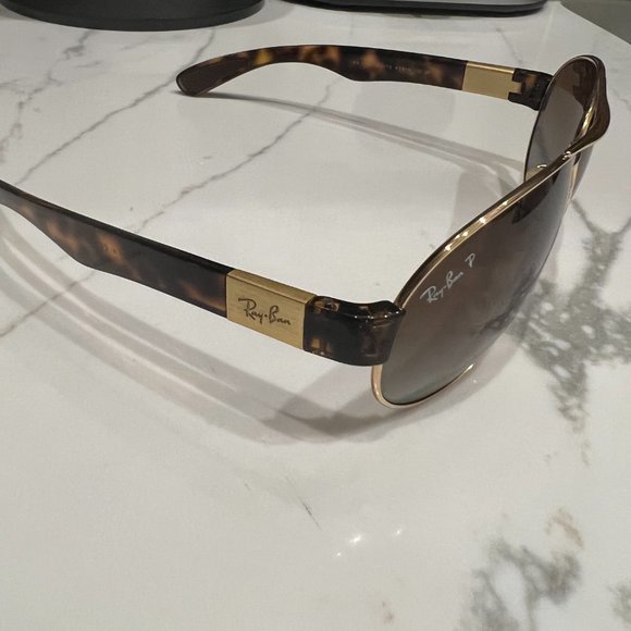 Rayban Polarized Aviator with gold frame, tortoise sides, and brown lens